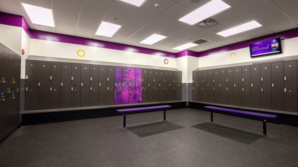 Planet Fitness Locker Room with their signature purple benches and black lockers.