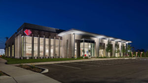 An exterior shot of the Southwest Venture headquarters lit up at night