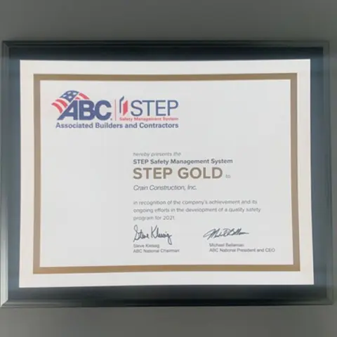 Crain construction's gold safety award certificate framed