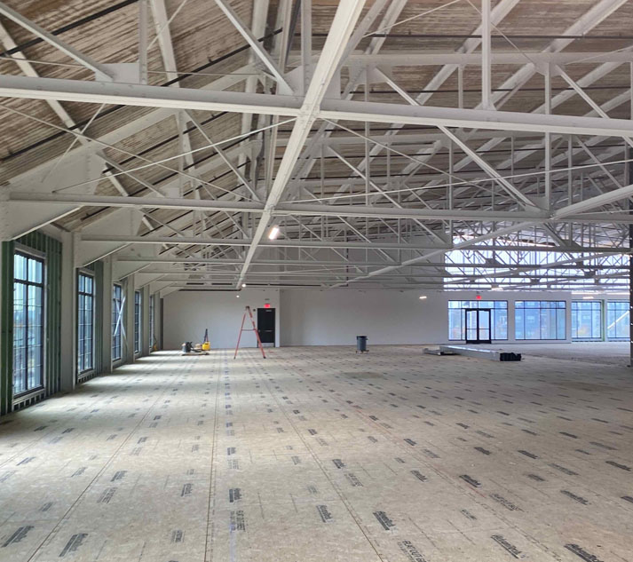 Specialty Dental Brands Headquarters under construction with exposed beams and unfinished floors.