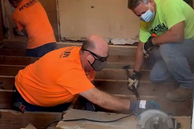 Crain Volunteers working on a kitchen installation