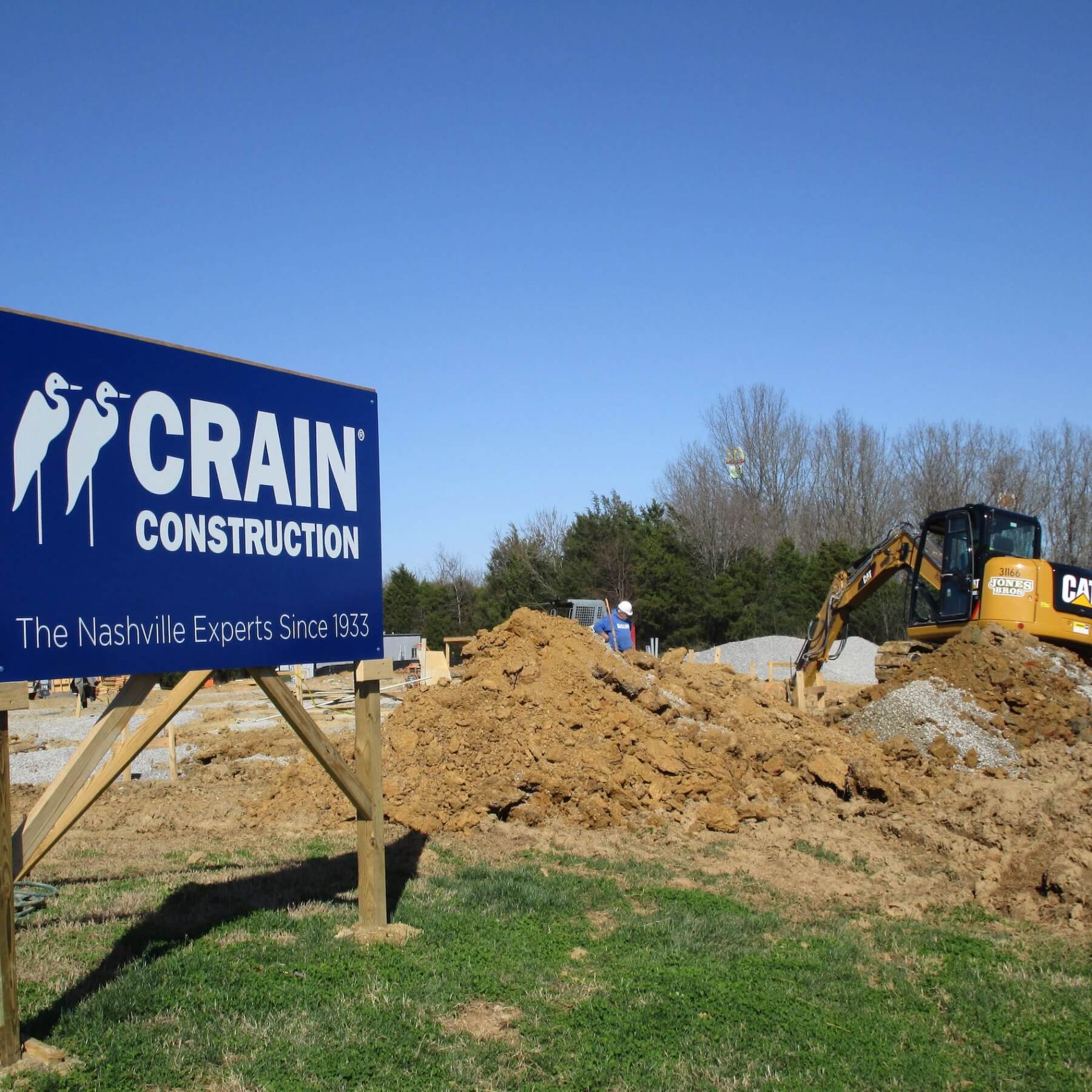 excavator on crain construction site
