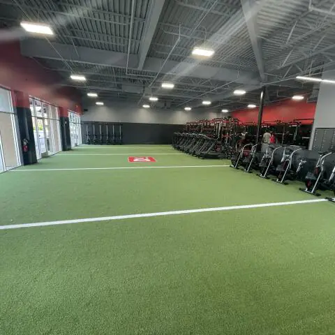 Wide shot of the turf field inside a D1 Training Facility in Spring Hill