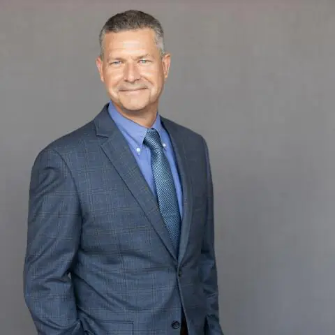 A professional portrait of Mike Gribble, VP at Crain Construction