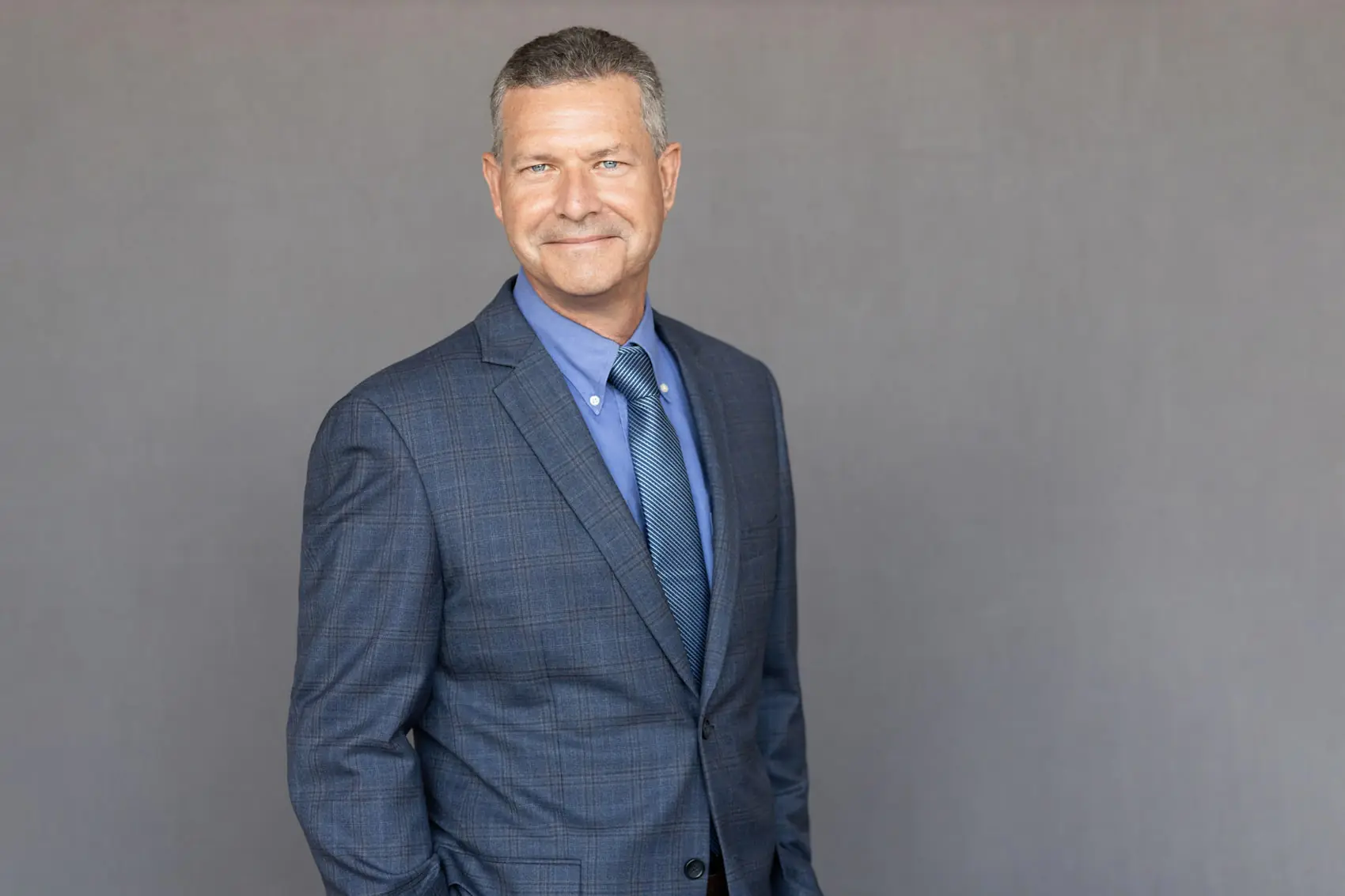A professional portrait of Mike Gribble, VP at Crain Construction