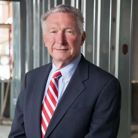 Lewis Rankina, a Crain Construction past CEO, in a professional portrait.