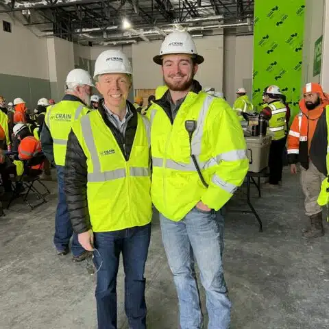 crain construction employees smiling for photo