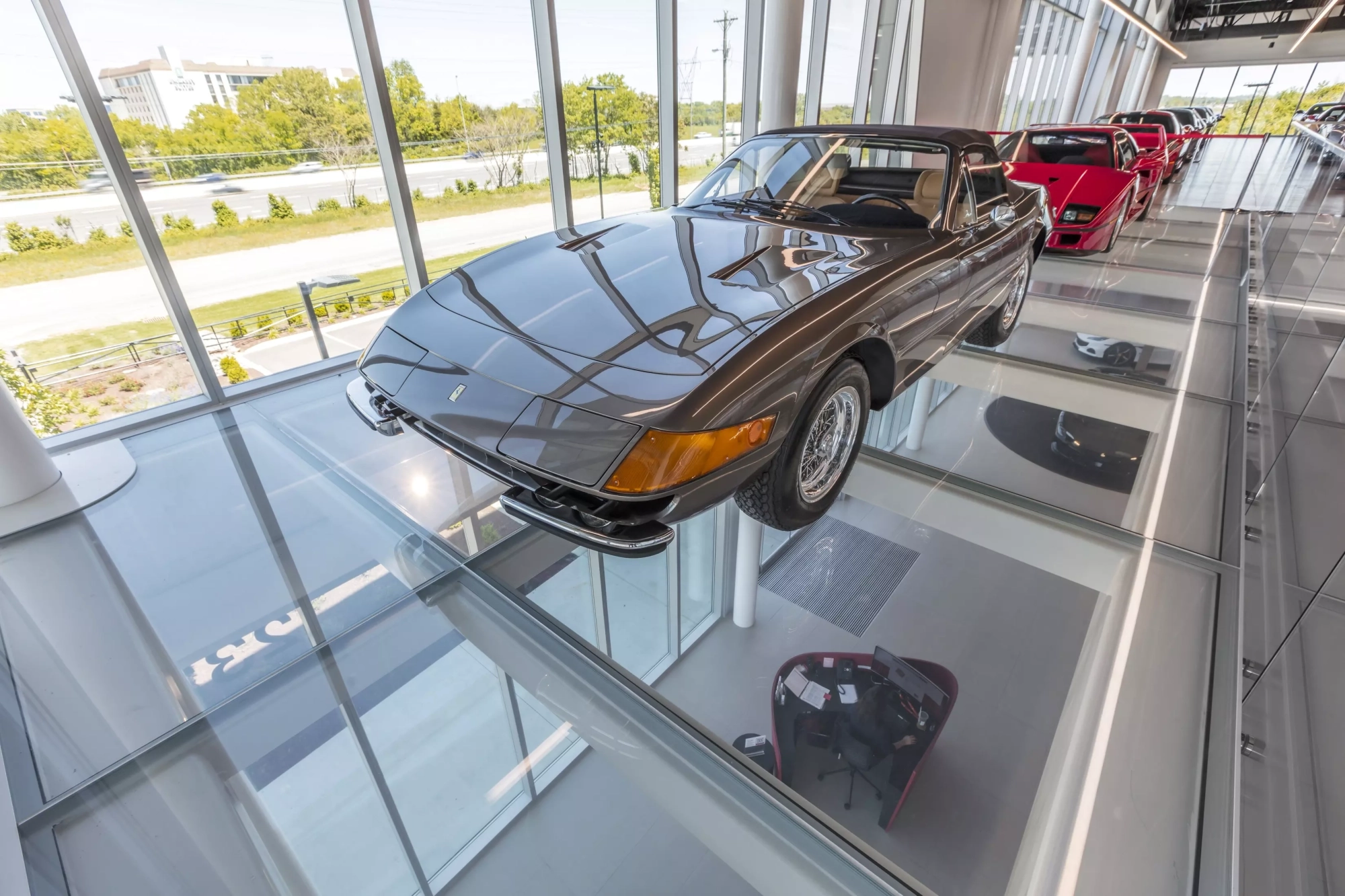 ferrari on display at auto dealership