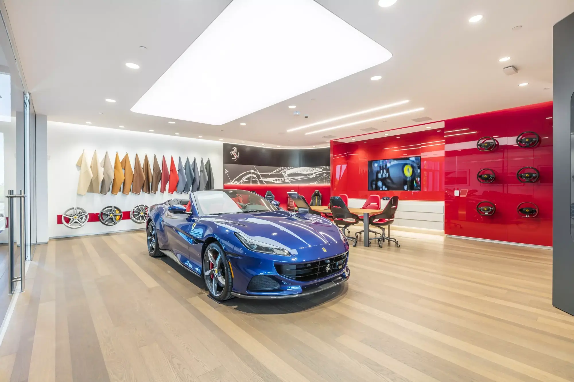 blue ferrari car at a dealership