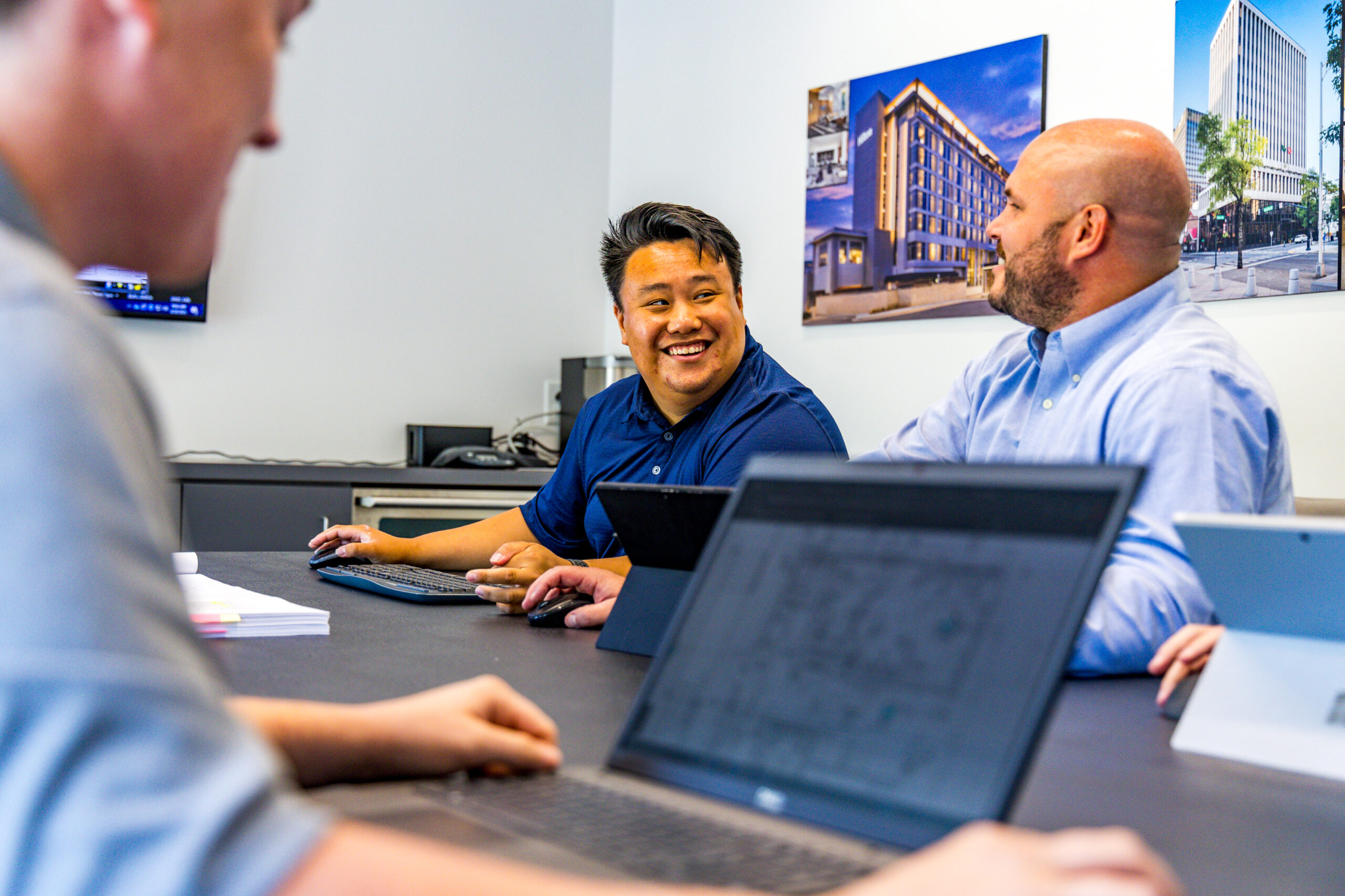 crain construction employees smiling in a meeting