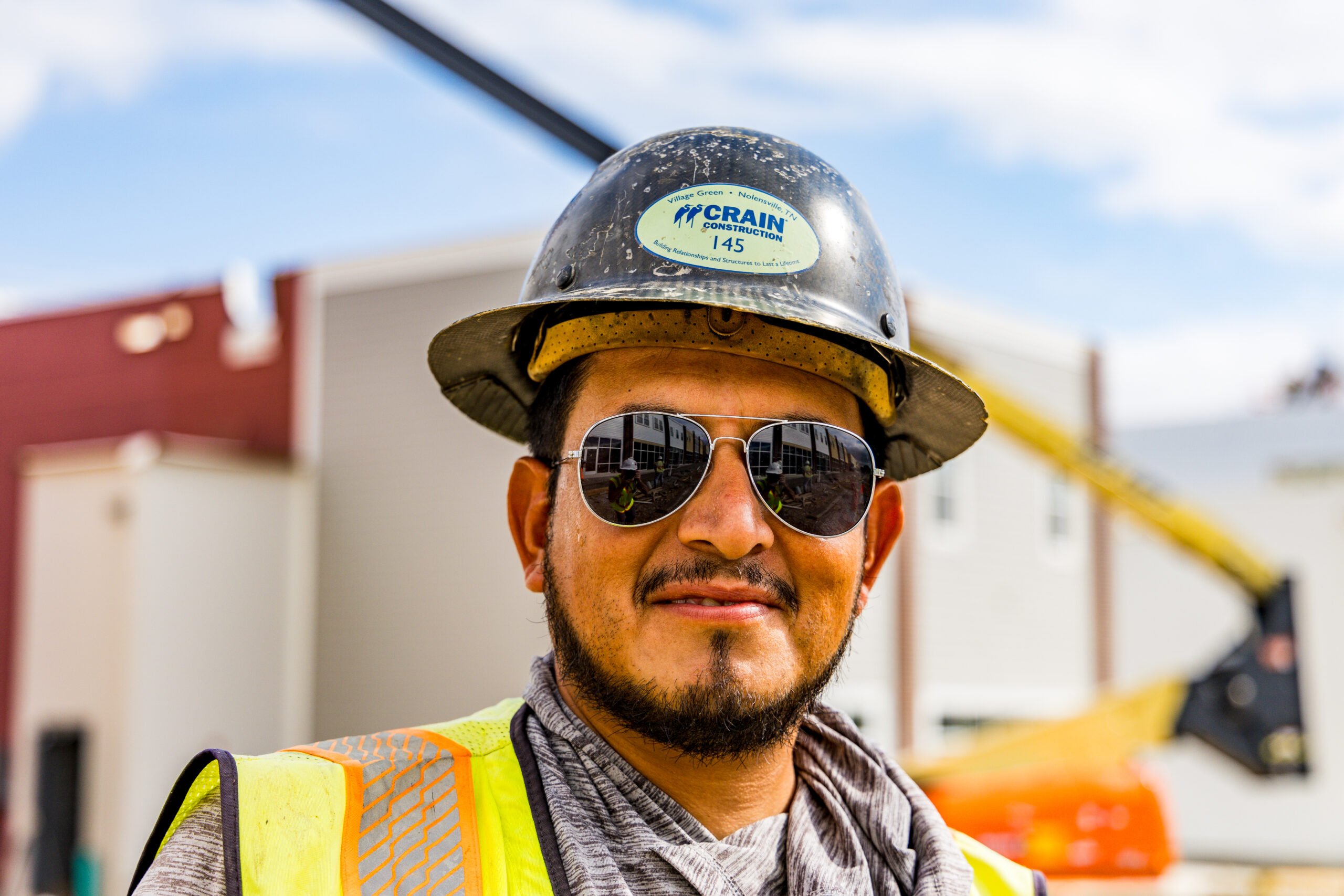 worker in crain construction safety hardhat