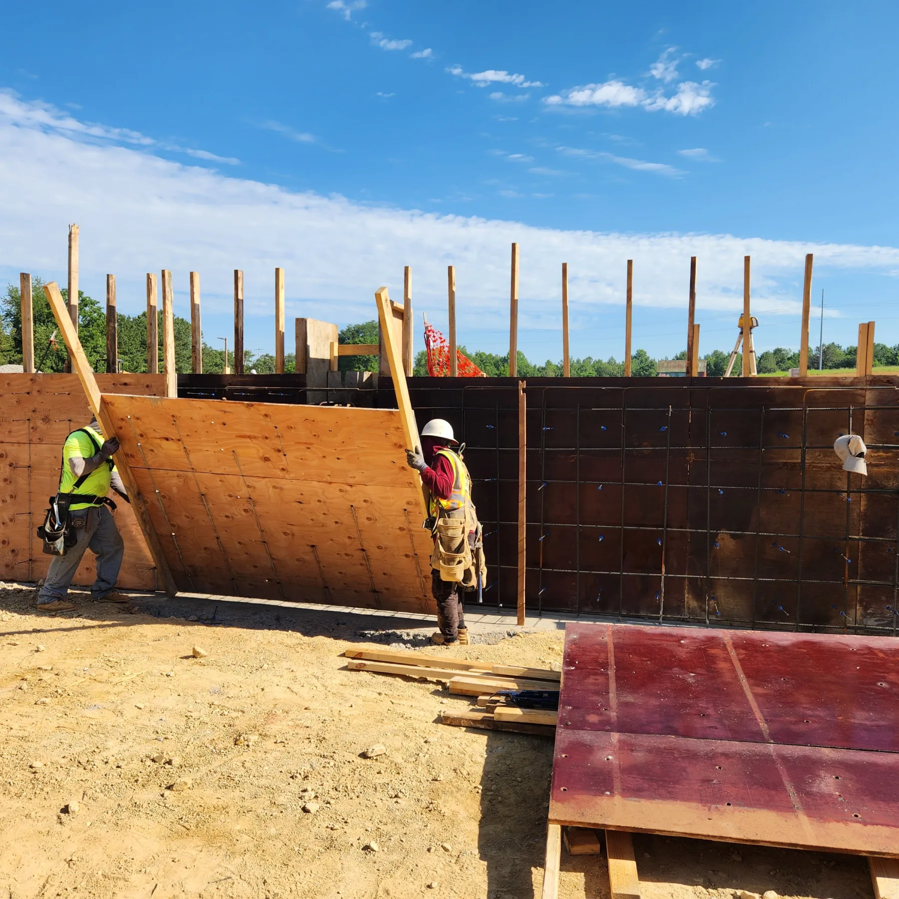 construction workers building a wall