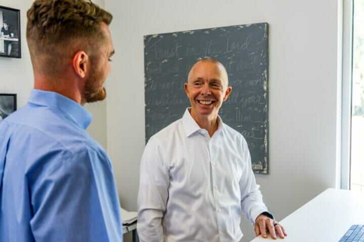 two crain construction employees in office